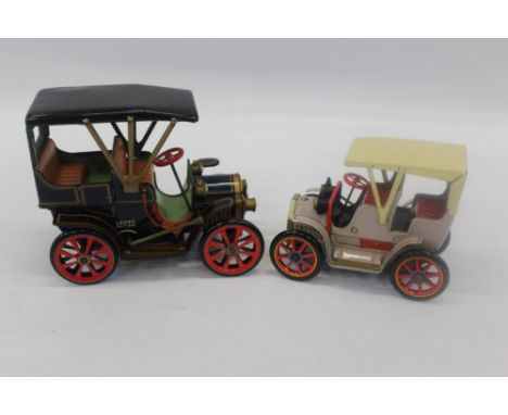 Two Japanese tinplate clockwork lever-action vintage cars