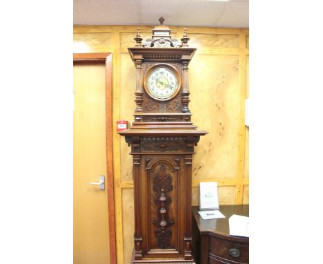 Rare late 19th century German walnut cased symphonium music hall clock, the impressive architectural case with turned finials