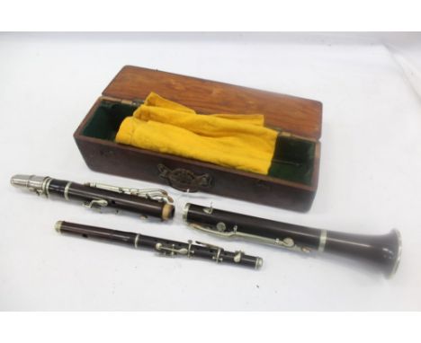 Rosewood or cocobolo wood clarinet stamped 'C' on both pieces and initials - J.T.L. on the finger plate, together with a 'Wig