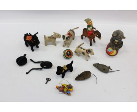 Group of felted vintage clockwork toys by Schuco and others