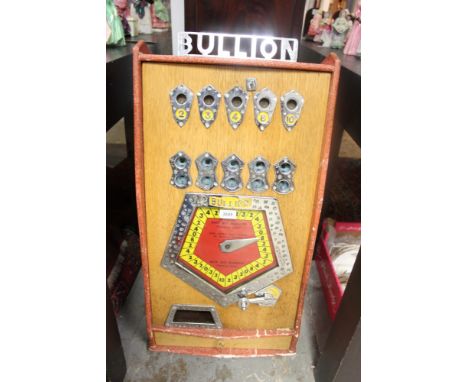 Vintage 'Bryans Bullion' penny slot machine with chrome and painted detail, oak-finished case, 84cm high CONDITION REPORT key