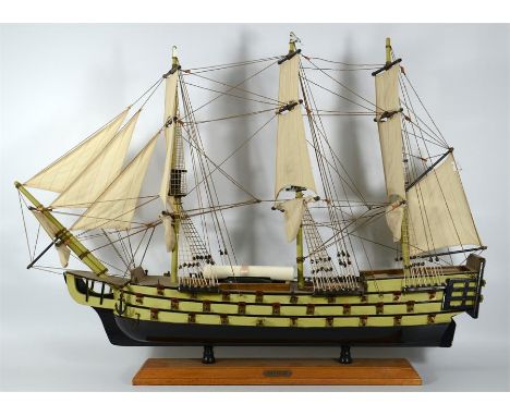 A model of HMS Victory with string rigging and cloth sails. Total length 79cm