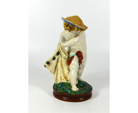 A Royal Worcester majolica figure of a fisher boy, circa 1870. Height 19cm.