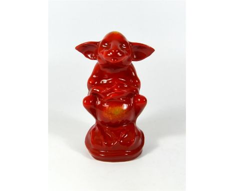 A Bernard Moore Pottery model of Gazeka, modelled seated on haunches, covered in a red lustre flambe glaze. BM monogram. Heig