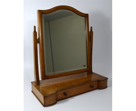 A Cotswold School Arts and Crafts oak dressing table mirror, on two drawer box base. Height 52cm.