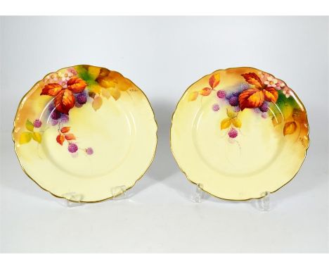 A pair of Royal Worcester plates, decorated with blackberries. Signed K.Blake. Dated 1933. Diameter 22.5cm. (2)