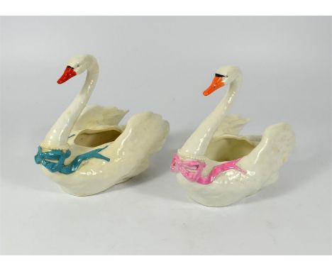 A pair of Royal Worcester male and female swans, impressed marks, circa 1880. Height 14cm.
