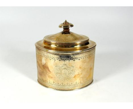 A Georgian silver tea caddy, oval shaped straight sided with hidden flat hinge, by Michael Plummer, London 1791. Height 16cm.