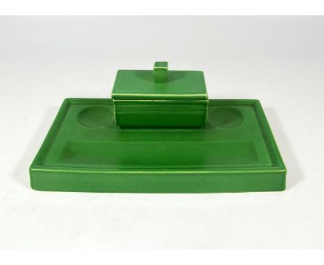 A Wedgwood china desk set designed by Keith Murray in matt green glaze, the inkwell containing the original two small green i