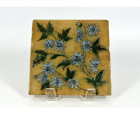 A Martin Brothers tile, decorated with flowers. Unmarked. 15cm x 15cm.