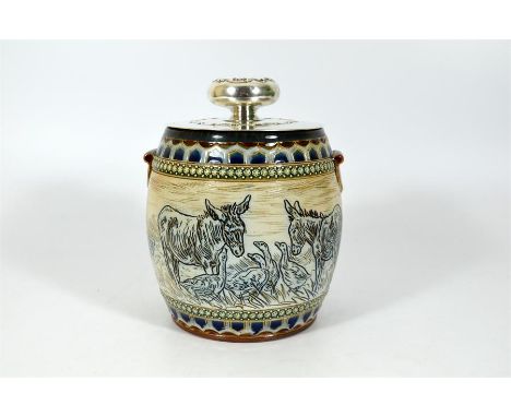 A Doulton Lambeth Hannah Barlow biscuit barrel showing a farmyard animal. With an American sterling silver lid (marked Theodo