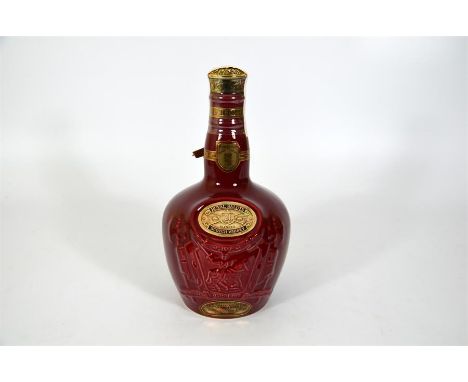 A bottle of Chivas Royal Salute whiskey, in a red ceramic wade bottle, 21 years old 40%vol, 750ml