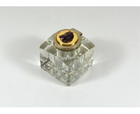 A silver topped glass inkwell, with a horse decoration plaque inset. London 1901. Height 7cm.