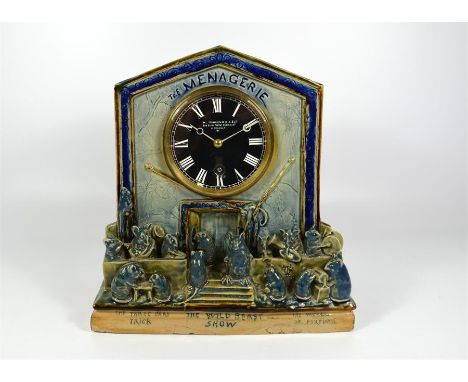 A Doulton Lambeth George Tinworth stoneware clock "The Menagerie". Incised artist initials. Circa 1885. Height 24cm.     