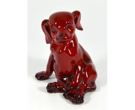 A Royal Doulton flambe model of a seated puppy. Printed marks. Circa 1925. Printed marks. Height 11cm.