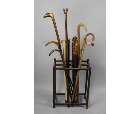 A Vintage Eight Division Stick Stand Containing Large Quantity of Walking Sticks and Umbrella to Include Silver Topped Ebonis