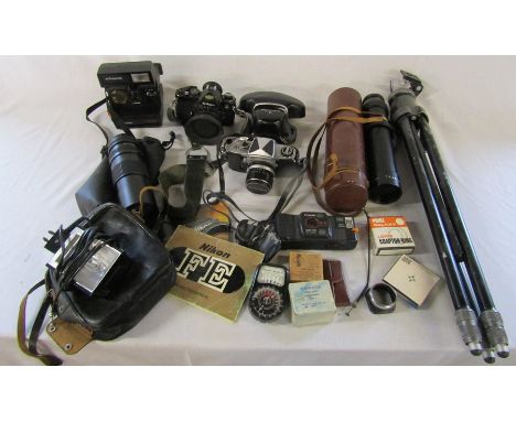 Selection of cameras and camera equipment inc Nikon FE camera, Miranda, Polaroid and Canon cameras, lens, tripod etc