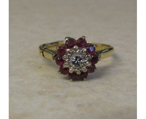 18ct gold ruby and diamond cluster ring (central diamond 0.10 ct) size P weight 4.3 g