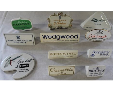 11 ceramic advertising plaques including Wedgwood, Aynsley, Capo di Monte, Colclough, Denby