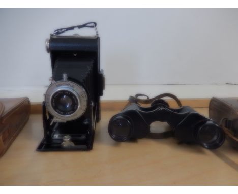 cased binoculars and  vintage kodak brownie folding camera with case