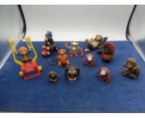 collection of monkey toys- vintage swingers with rolling eyes, chimp lighter, wind ups etc