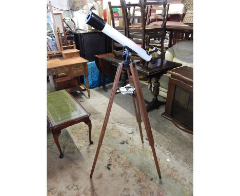 Telescope on wooden tripod 