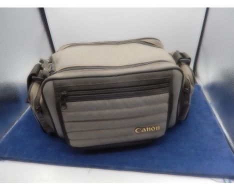 Canon t70 camera in carry bag with lens etc