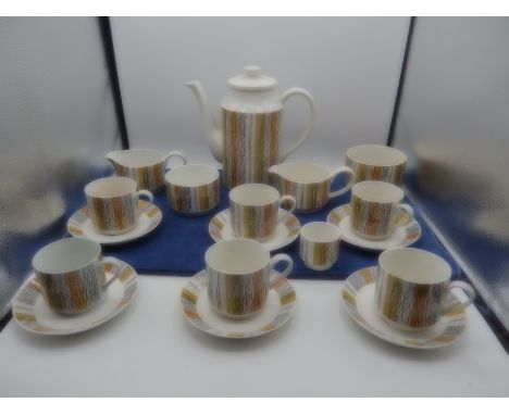 Staffordshire midwinter tea set comprising of tea pot, 6 cups and saucers, 2 sugar bowls and egg cup