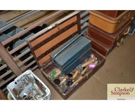 A wooden storage box and metal toolbox with contents