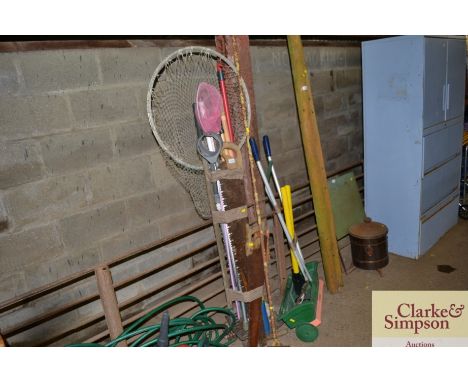 A quantity of mostly long handled gardening tools etc.