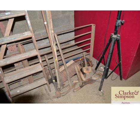 A quantity of various hand saws and tools; and various long handled gardening tools 