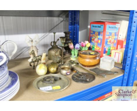 A quantity of metal ware and ornaments to include an oil can, brass horse, candlestick etc.