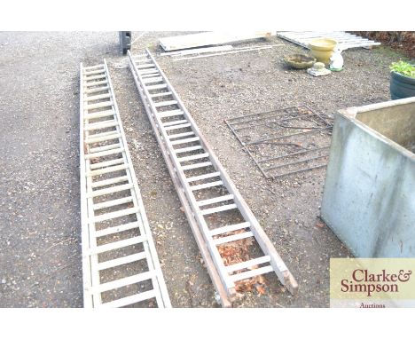 A wooden and metal extending ladder