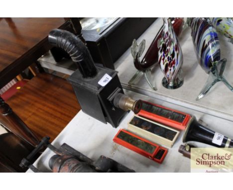 A child's Magic Lantern and a quantity of slides 