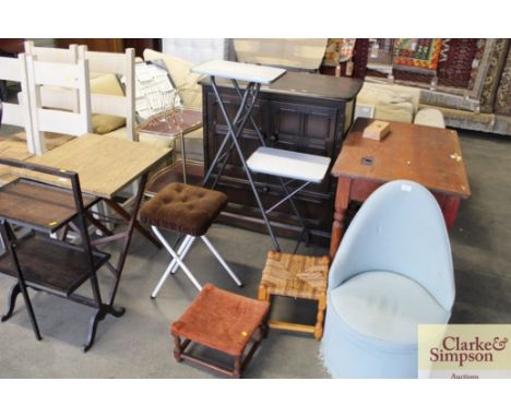 A projector table, a folding string works stool and one other