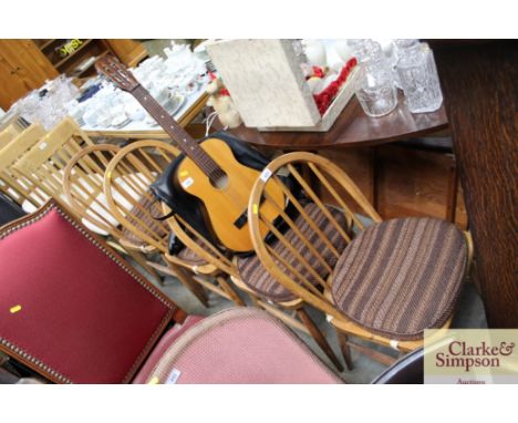 A set of four Ercol style stick back dining chairs 