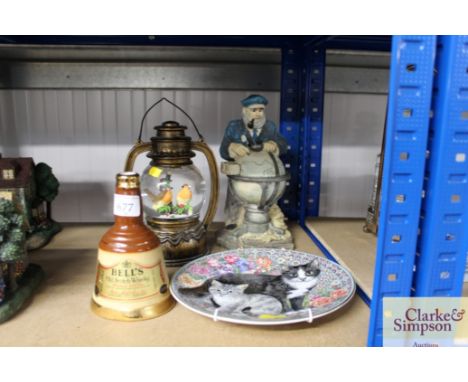 A Bells Old Scotch whisky bottle (empty), figure of a Sea Captain, snow globe in form of lantern, Royal Worcester collectors 