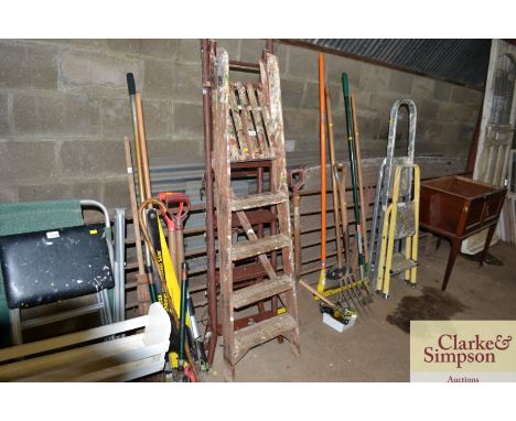 A metal step ladder and a wooden step ladder