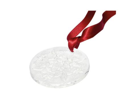 Factory sealed, the clear crystal Poinsettia 2020 annual Christmas ornament features intricate detailing with petal-like text