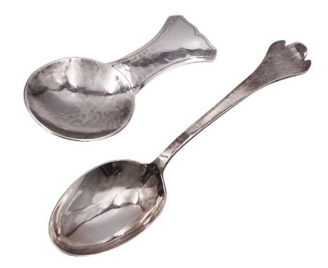 Two modern Arts and Crafts style silver spoons both by Guild of Handicraft, the first example a caddy spoon with hammered fin