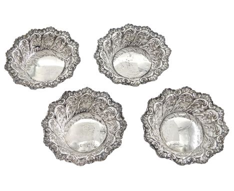 Set of four Victorian silver bon bon dishes, of circular form, with shaped rim and embossed foliate scroll decoration, hallma