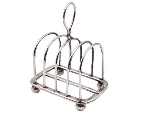 Victorian silver five bar toast rack, with curved bars and central ring handle, upon four ball feet, hallmarks Henry Wilkinso