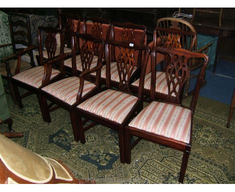 A reproduction set of eight (including two carvers) Dining Chairs, Chippendale in style, in Mahogany with pierced fret-cut sp