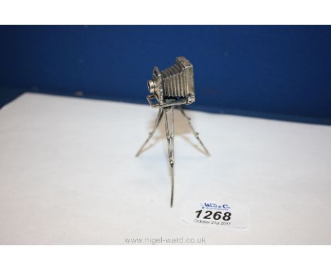 An unusual Silver model of a vintage Camera on tripod, 3 1/4'' tall.