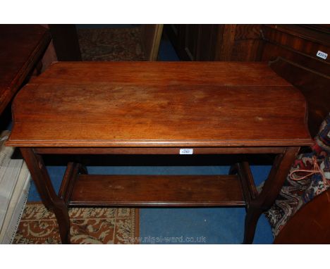 An Edwardian Mahogany rectangular top Occasional Table on shaped legs with lower plank stretcher on ceramic castors.