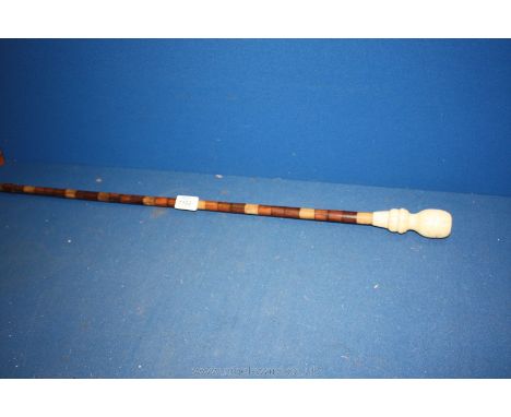 A 20th c. Walking Stick made of exotic woods with large turned bone handle, 34'' long