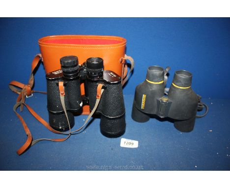 A pair of cased Zenith 10x50 Binoculars and a pair of Bushnell Binoculars 