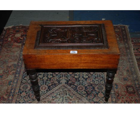 A Victorian Mahogany cased ceramic Bidet, the lifting lid with carved panel, on turned legs.