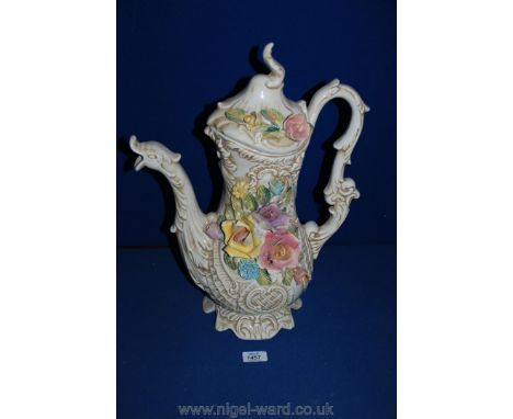 A large Capo di Monte teapot with applied flowers and dragon spout