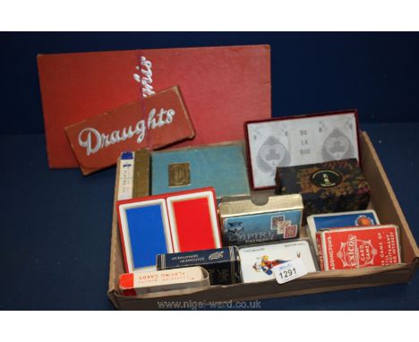 A Draughts board and draughts, miscellaneous playing cards, stress balls, etc.